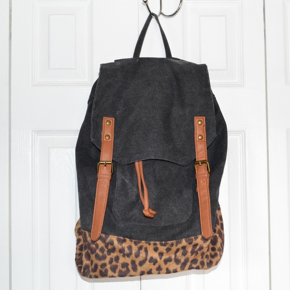 Canvas/jean with suede cheetah print backpack.